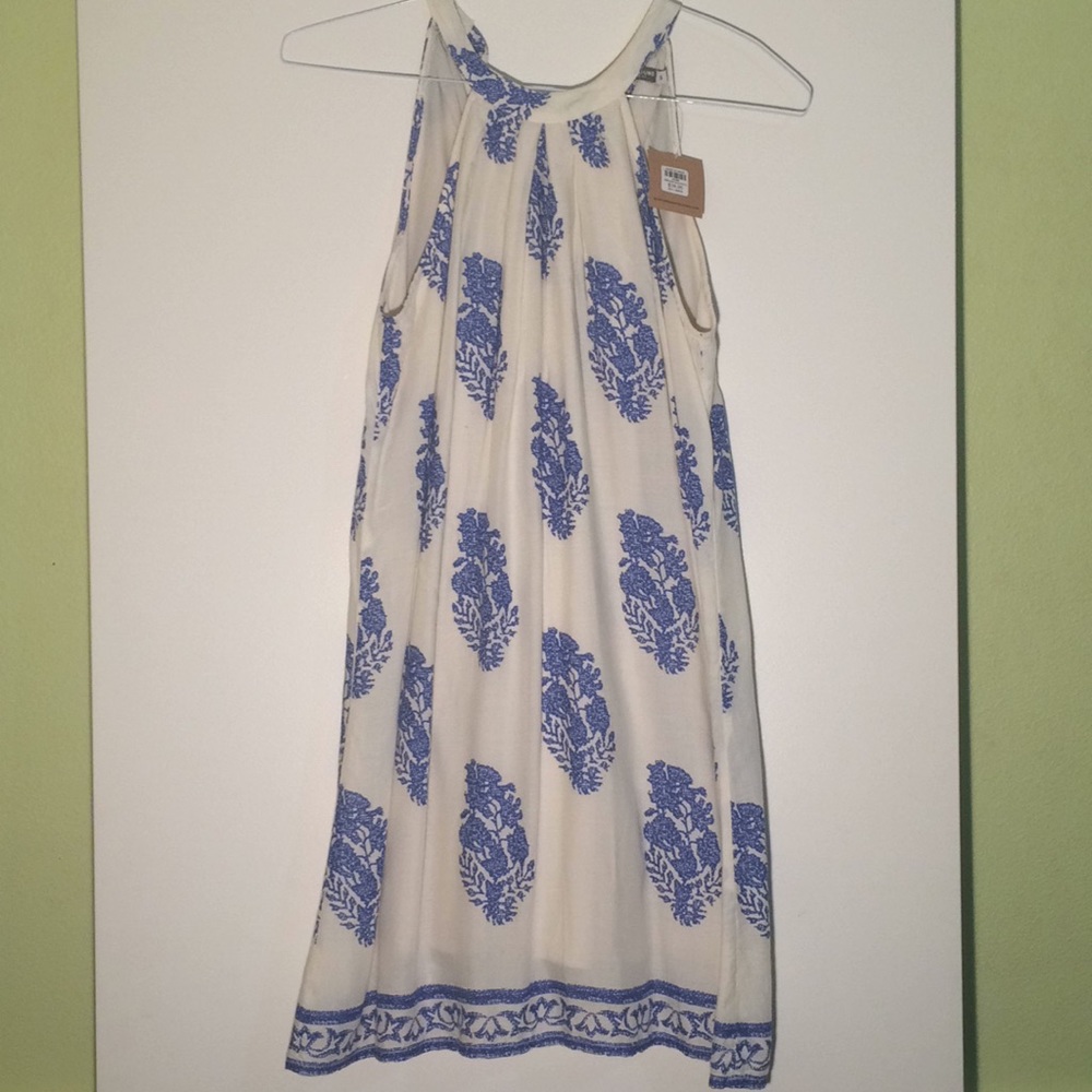 White dress with blue floral pattern